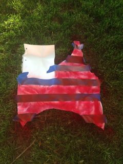 A DIY Fourth of July flag on the grass.