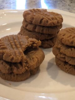 Keto peanut butter cookies on a white plate.