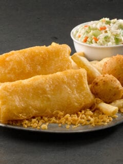A plate of fish and chips, inspired by Long John Silver's, with a Side of cole slaw.