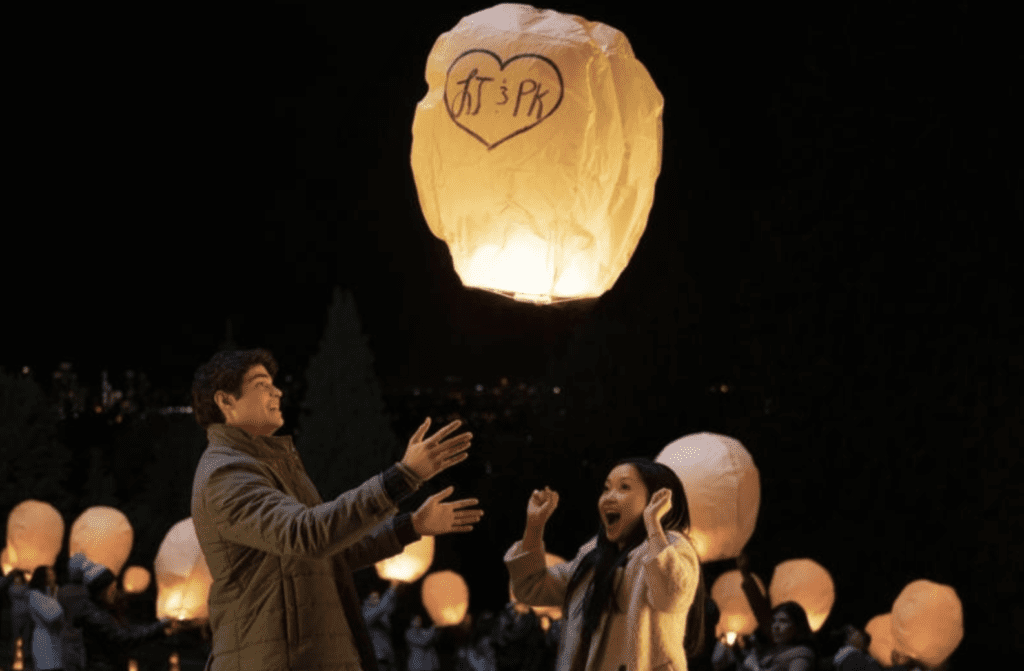 Boy and girl releasing paper lantern in Netflix Original rom-com To All The Boys
