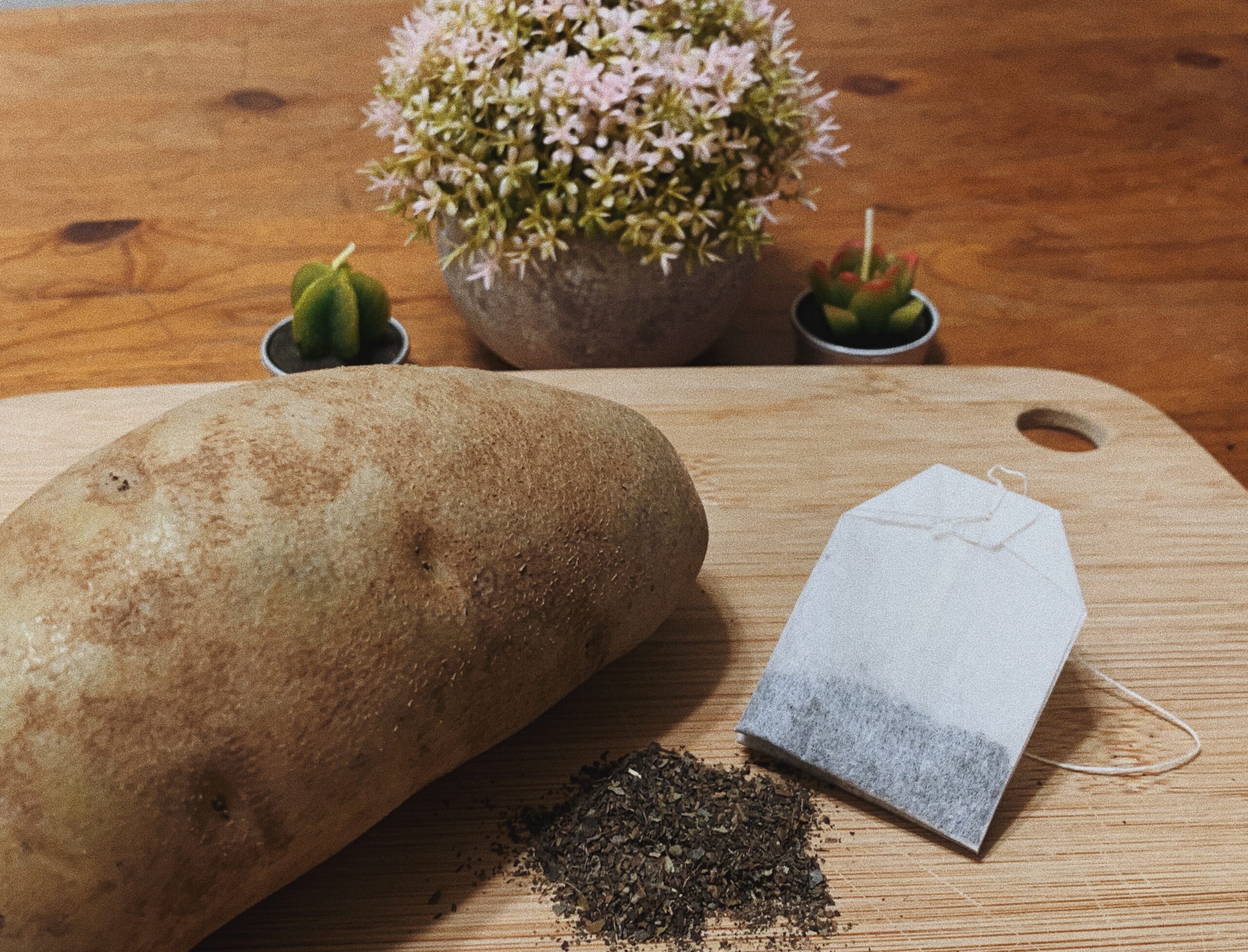 A natural skincare treatment featuring a potato and tea bag.