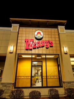 The exterior of a Wendy's restaurant at night, known for its Weight Watchers points.