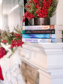 Christmas books on a mantle.