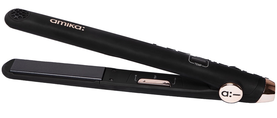 amika is a black flat iron with rose gold accents. It is slim with longer ceramic plates. There is a small temperature screen on top, and controls located on the inside. 