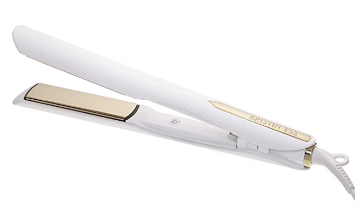 A slim cyclindrical flat iron. It is a soft white with a gold accent strip on top, and gold ceramic plates. The power button is located on the inside. 