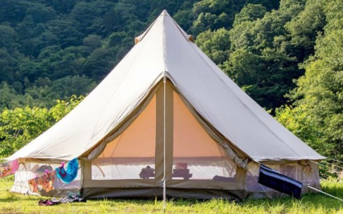 The Canvas Camp Sibley ProTech Bell Tent is shaped just like the bell tent shown above, but is much larger and equipped with see-through zippered doors. 