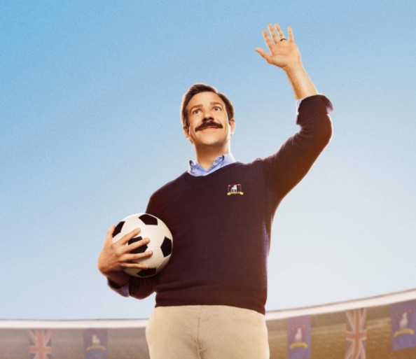 ted lasso holding soccer ball