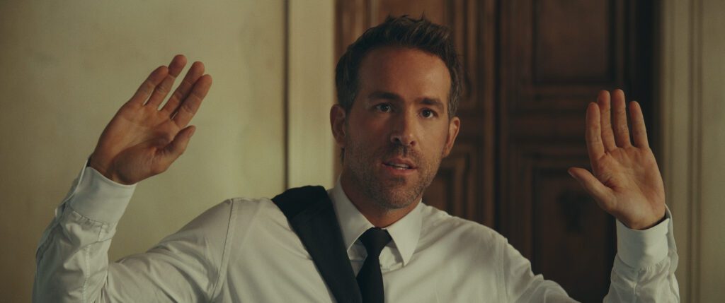 Ryan Reynolds as Nolan Booth in Red Notice.
