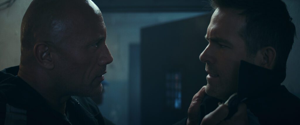 (L to R) Dwayne Johnson as John Hartley and Ryan Reynolds as Nolan Booth in Red Notice