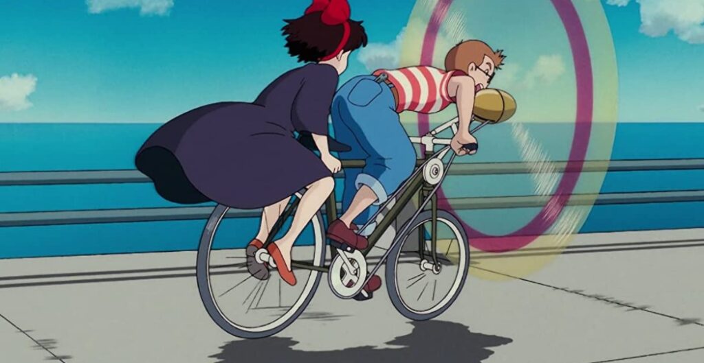 tombo and kiki on bike