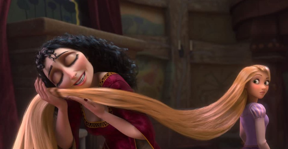 mother gothel stroking rapunzel's hair