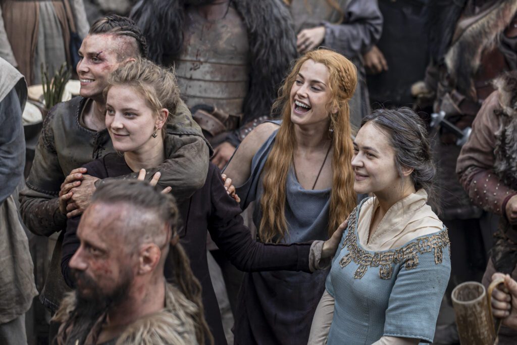 Eliza Butterworth as Aelswith and cast members of The Last Kingdom
