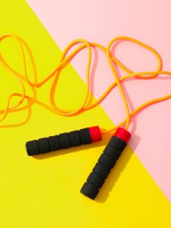 A pair of skipping ropes on a colorful background, showcasing the best shoes for jump rope.