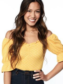 A young woman named Tammy Ly wearing a yellow top and jeans.