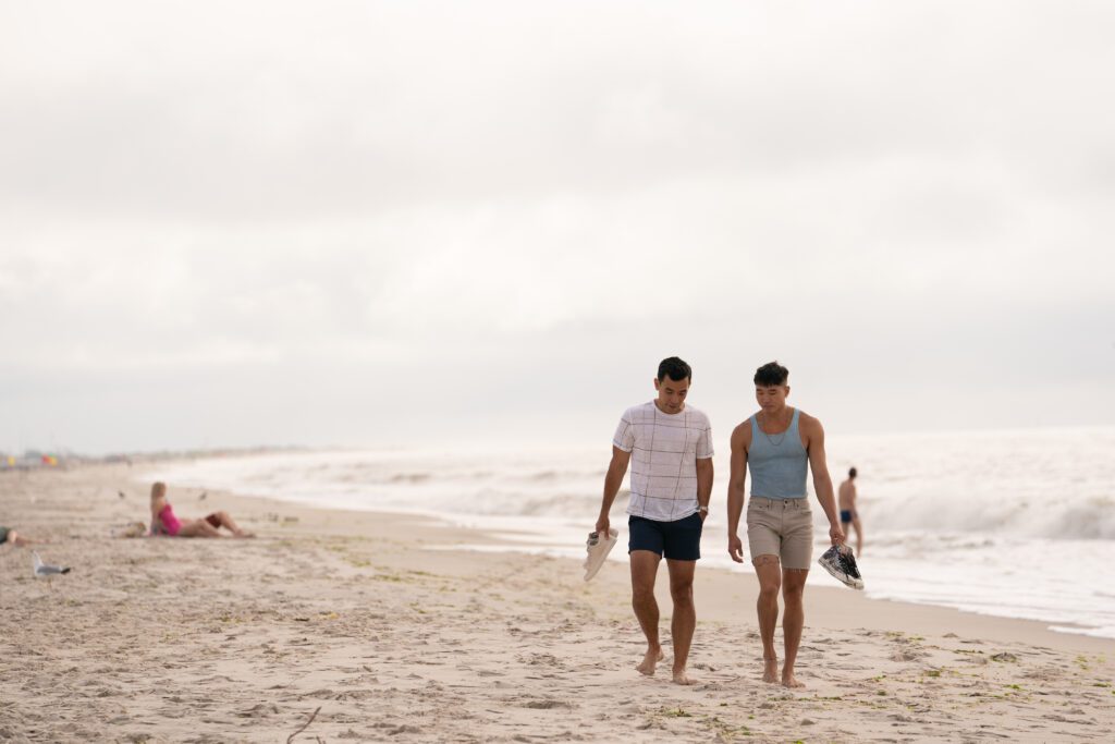 Noah and Will walking on beach