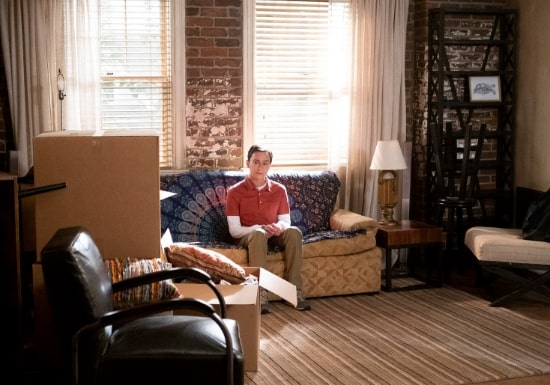 Sam sits around his new apartment. 