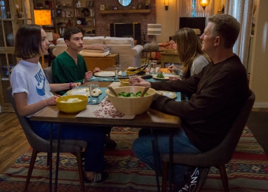 The Gardner family catches up at the dinner table. atypical