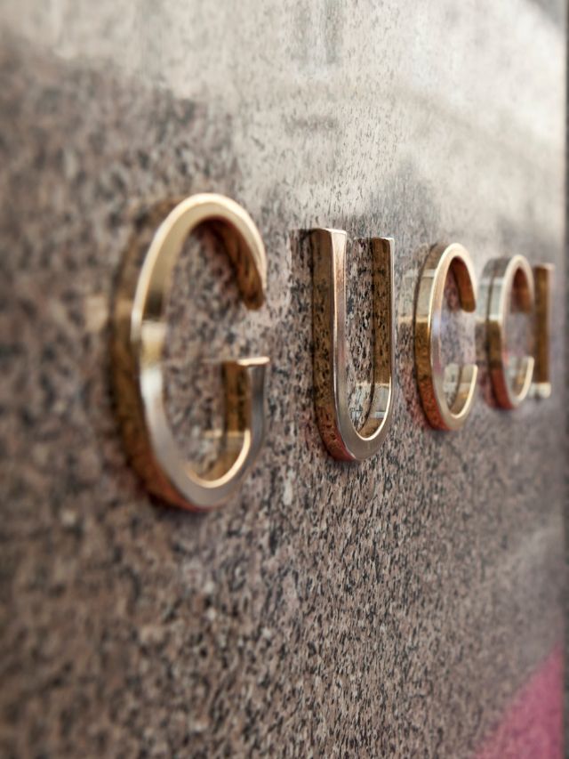 Gucci brand name on wall