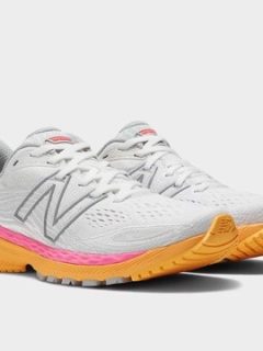 New balance women's running shoes in white and pink, perfect for ball of foot pain.