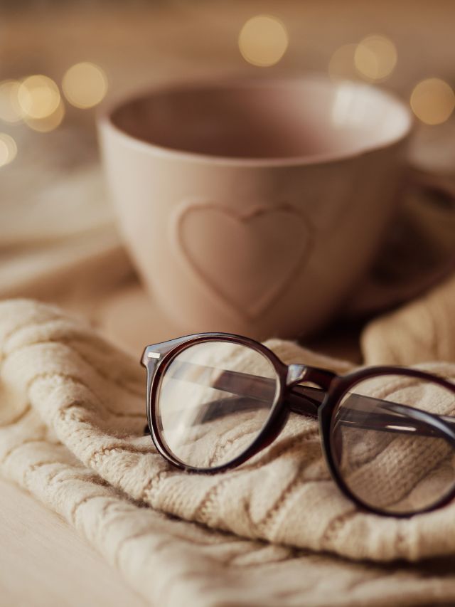 coffee cup on blanket with glasses