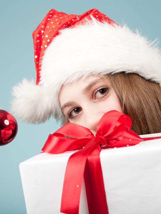 girl with santa hat and gift