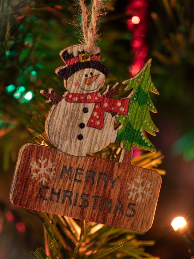 wooden snowman christsmas ornament hanging on the tree