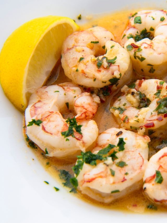 lemon and garlic shrimp in a white bowl