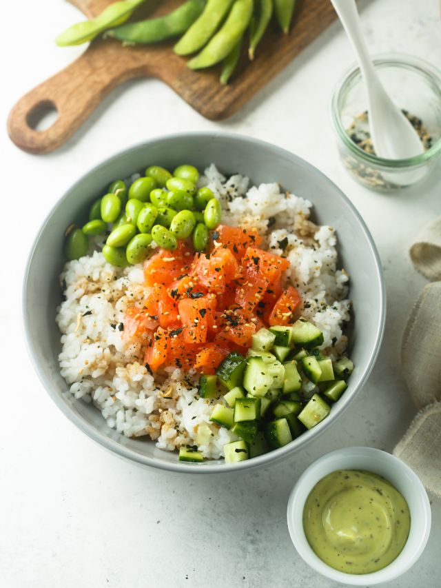 salmon rice bowl with cucumbers and edamame beans
