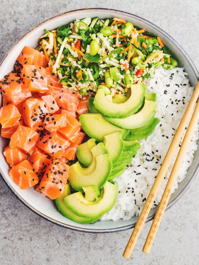 tasty and appetizing rice bowl with avocado and salmon