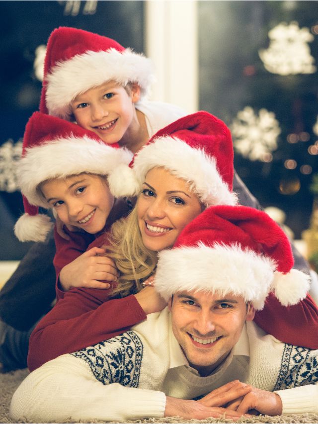 family of 4 in christmas hats