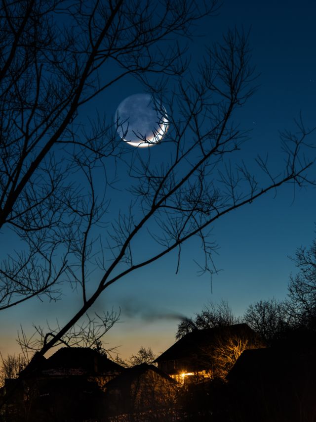 new moon against the night sky