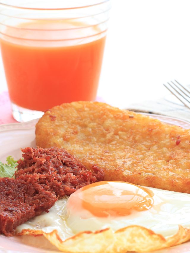 hash browns with egg, bacon, and tomato juice