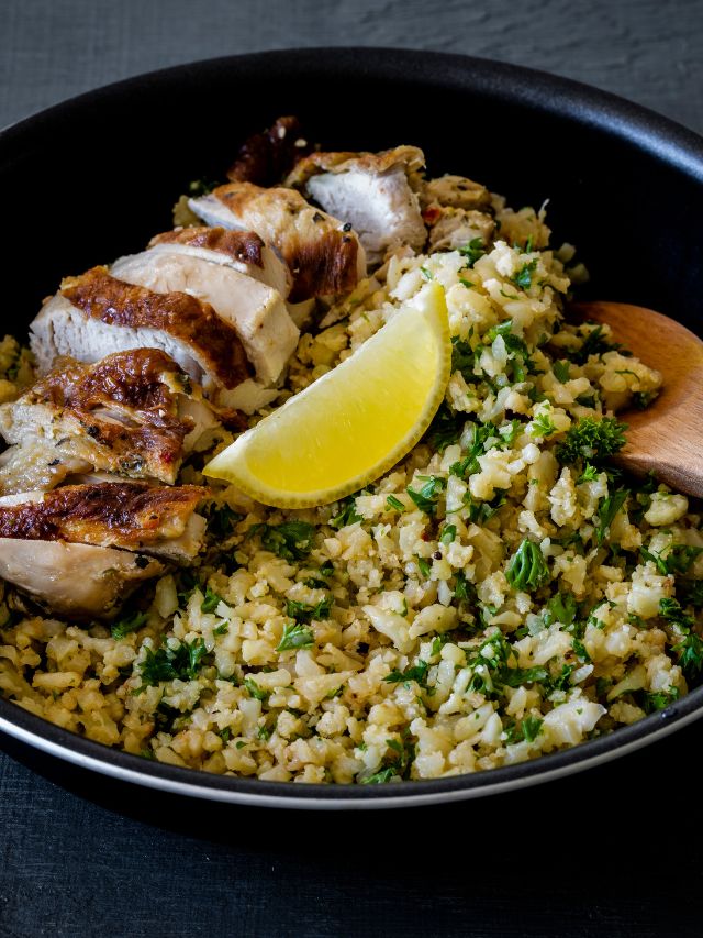 greek style chicken with cauliflower rice, lemon, and parsley