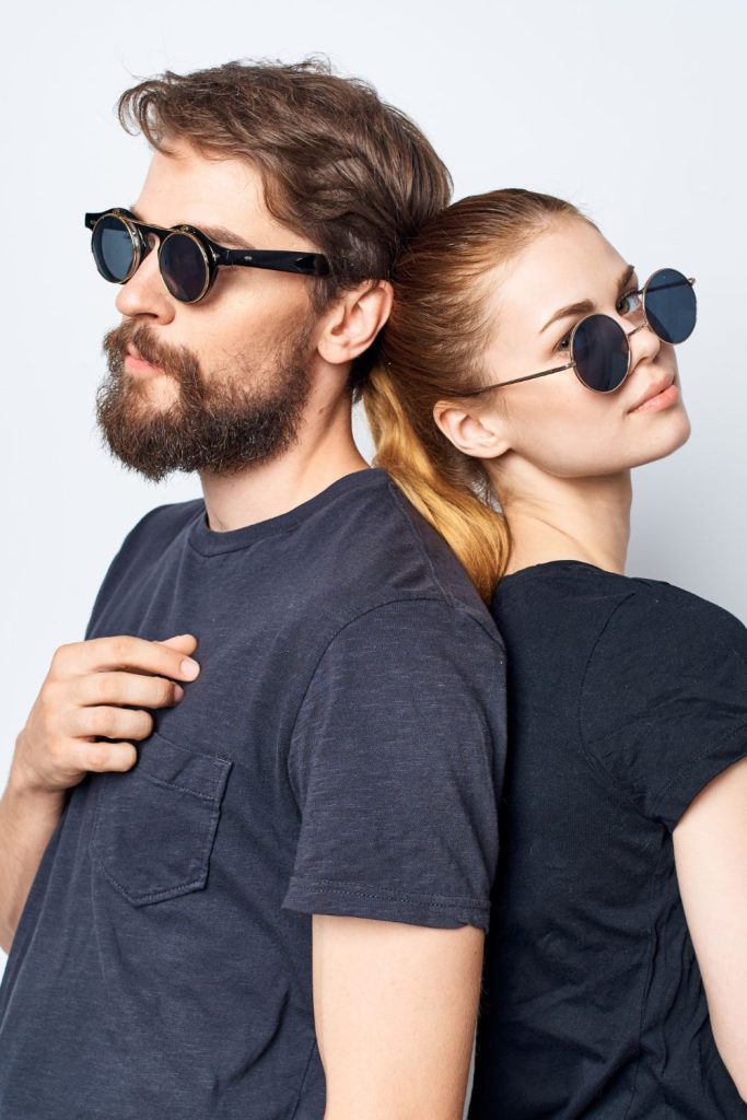 man and woman posing with glasses