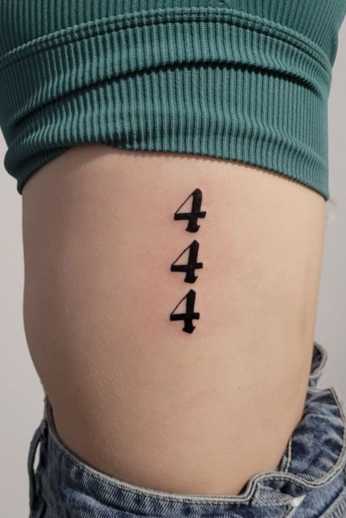 number 4 tattoo on side