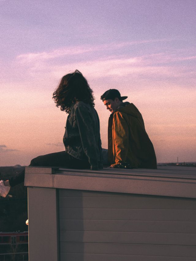 couple on building roof