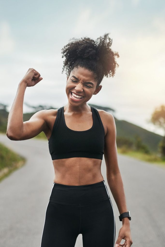 woman cheering herself on after exercising
