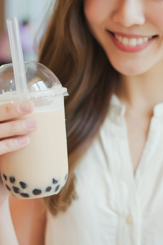 woman smiling with milk tea
