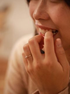 closeup of woman biting her nails