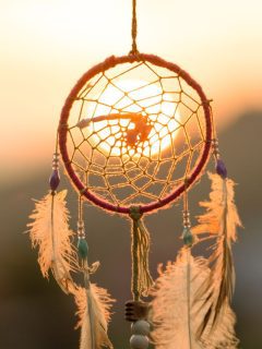 dream catcher in front of sunset