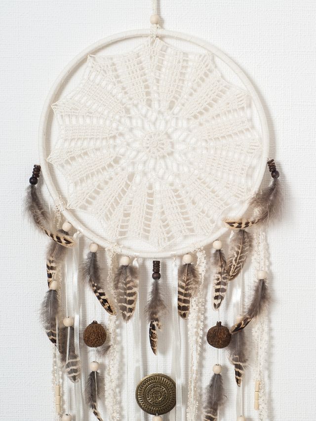 white dream catcher with feathers