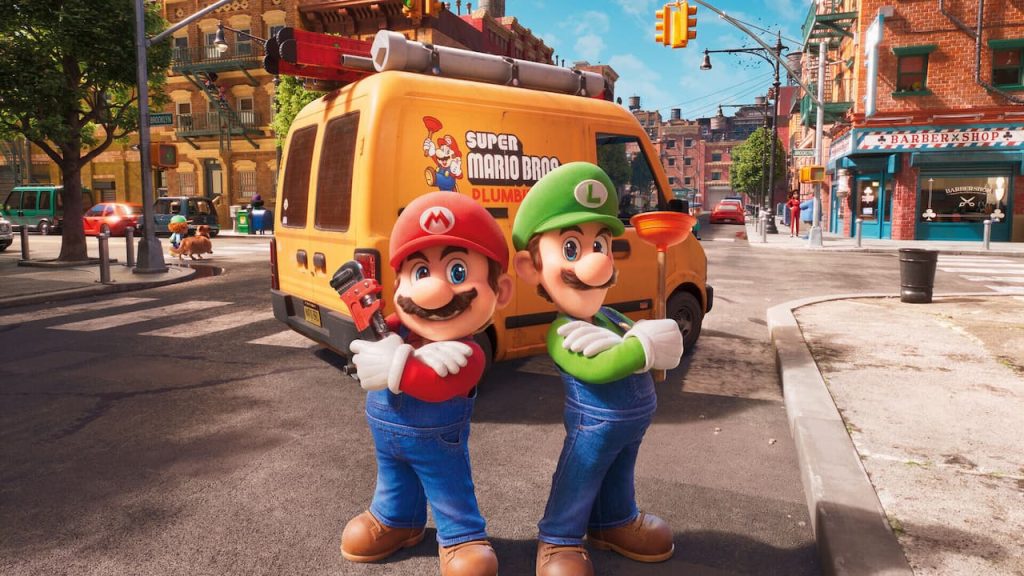 Two Super Mario Bros characters standing in front of a bus.