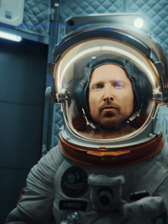 man in an astronaut suit inside a spaceship