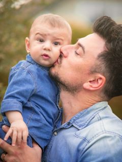 dad kissing baby