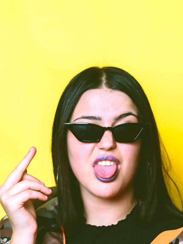 woman with glasses and middle finger up