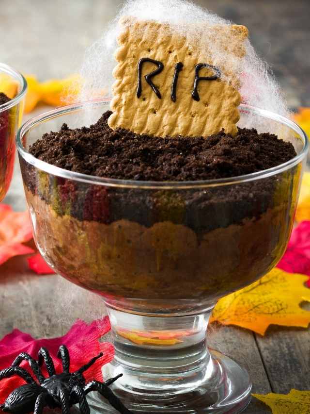 A halloween dessert with a sign saying rip in a glass bowl.