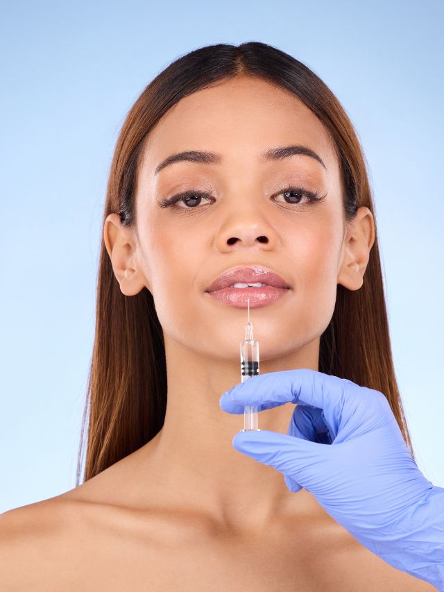 A woman undergoes a facial filler injection to enhance her appearance.