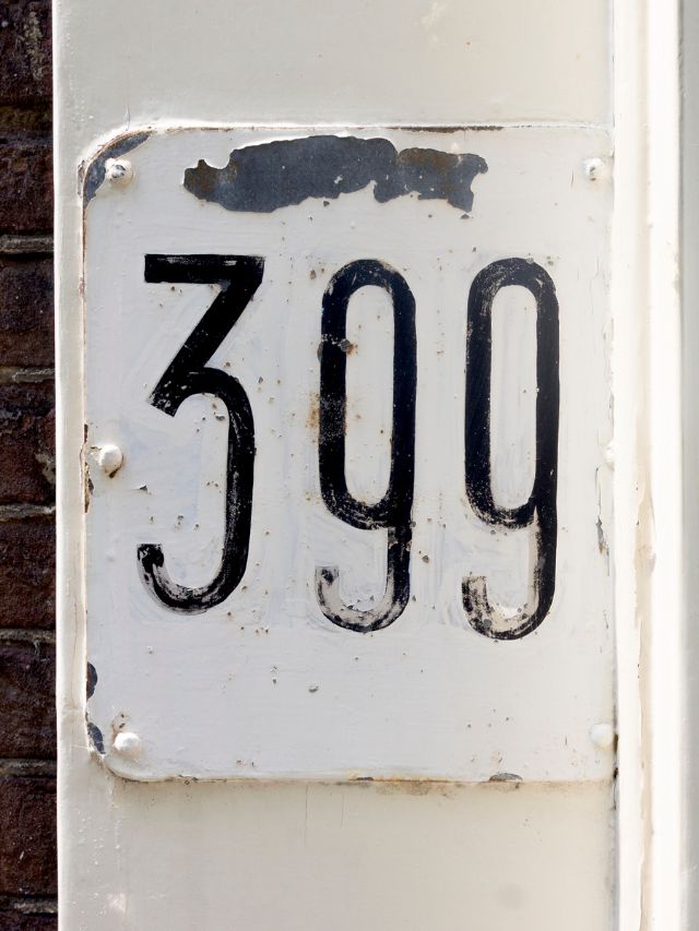 A house number sign with the number 399, carrying spiritual significance.