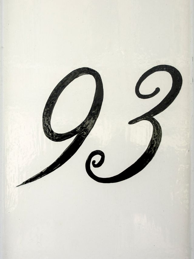 A sign with the number ninety-three on it.