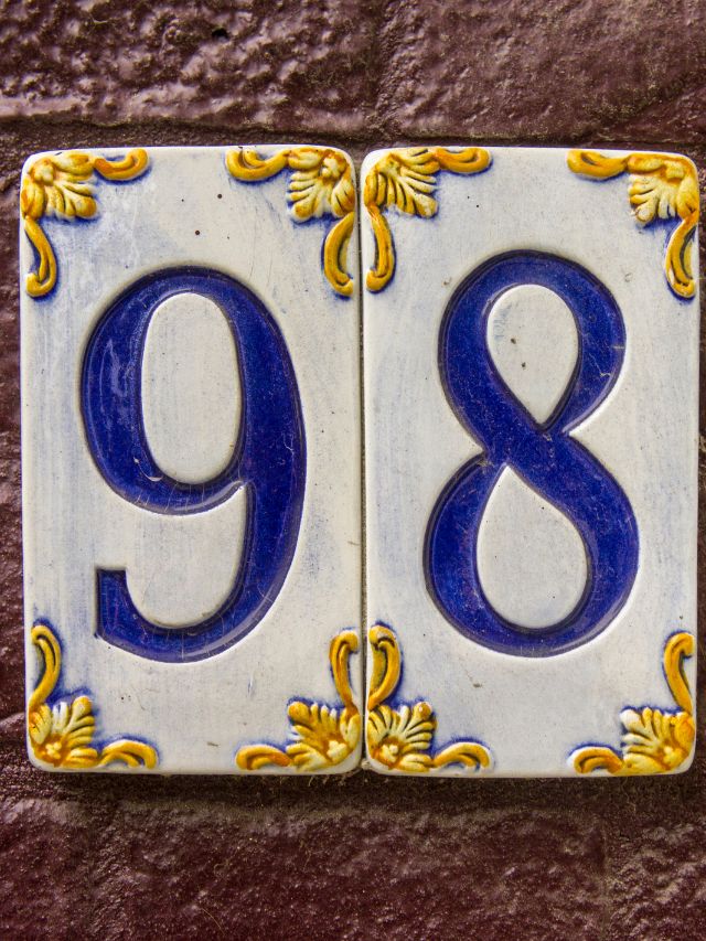 Two blue and white tiles with the number 89 on them.